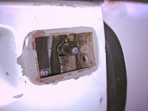 Drivers side, inside mechanics.