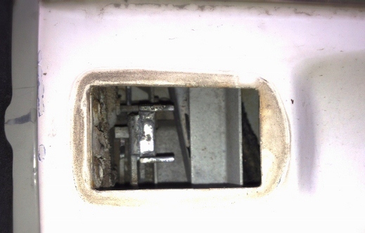 Passenger side, inside mechanics.